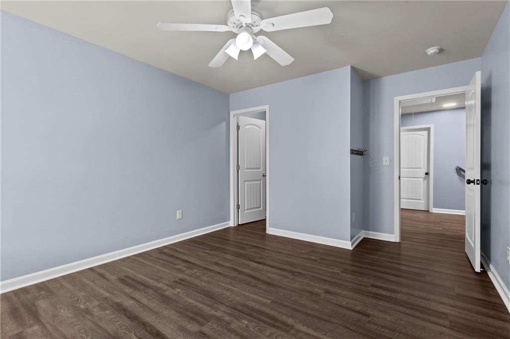 506 Olympic Way Acworth, GA 30102 - Photo 40 of 73 a view of an empty room with wooden floor