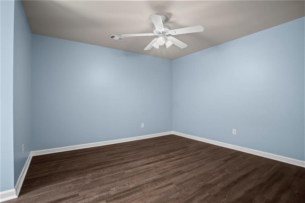 506 Olympic Way Acworth, GA 30102 - Photo 42 of 73 a view of an empty room with wooden floor