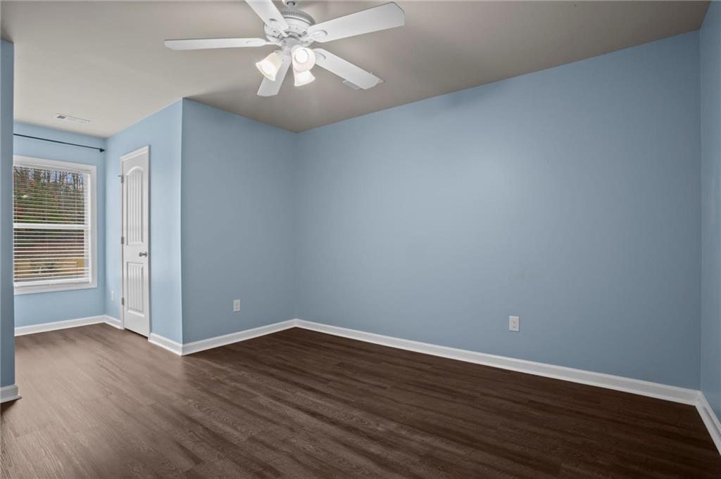 506 Olympic Way Acworth, GA 30102 - Photo 43 of 73 a view of an empty room with wooden floor