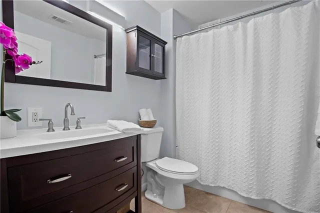 a view of a lake with boats and trees