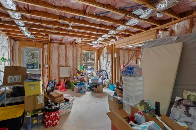 an aerial view of a house with swimming pool and furniture