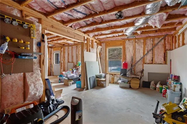 an aerial view of a house with swimming pool patio and outdoor seating