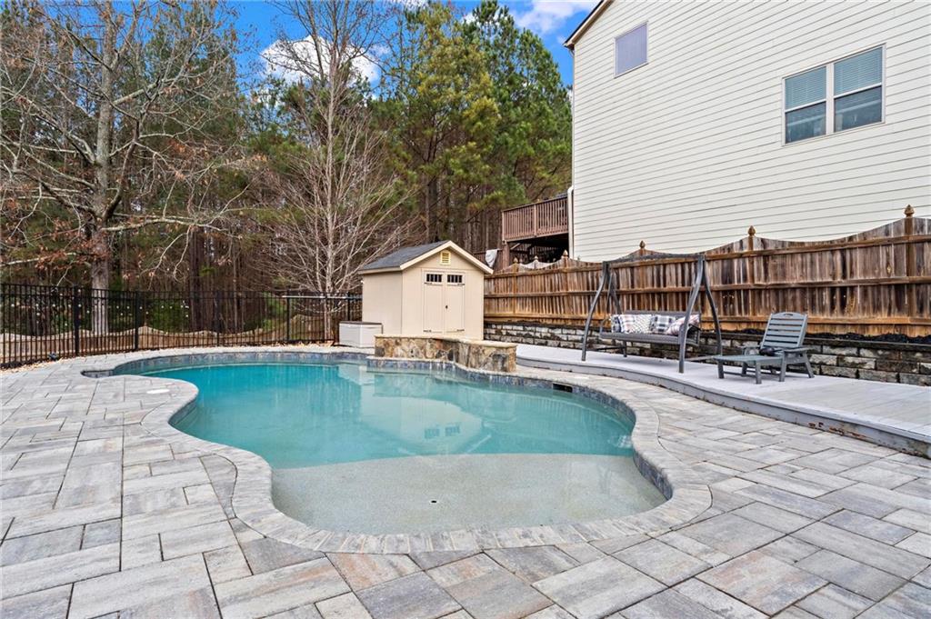 506 Olympic Way Acworth, GA 30102 - Photo 50 of 73 a swimming pool with outdoor seating and yard
