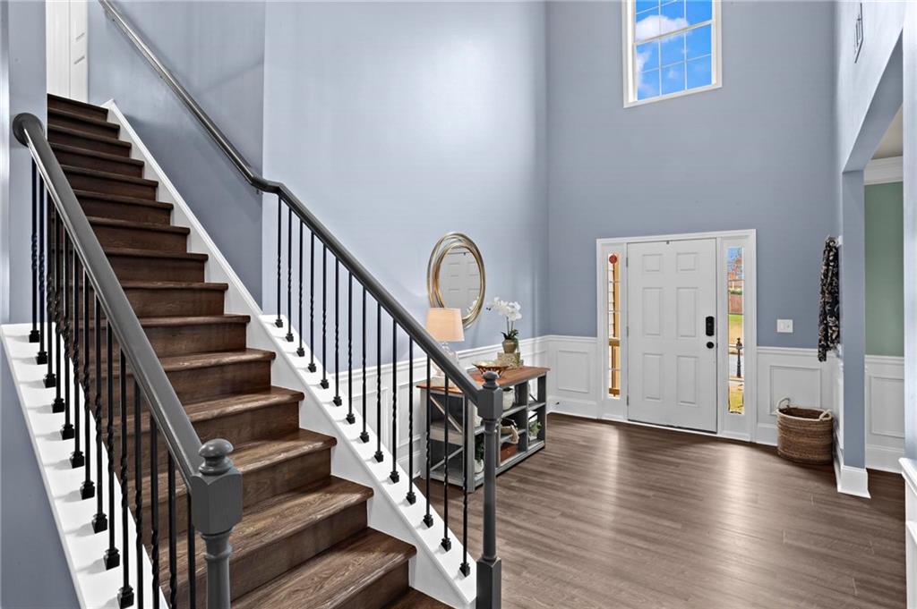 506 Olympic Way Acworth, GA 30102 - Photo 5 of 73 a view of an entryway with wooden floor and stairs