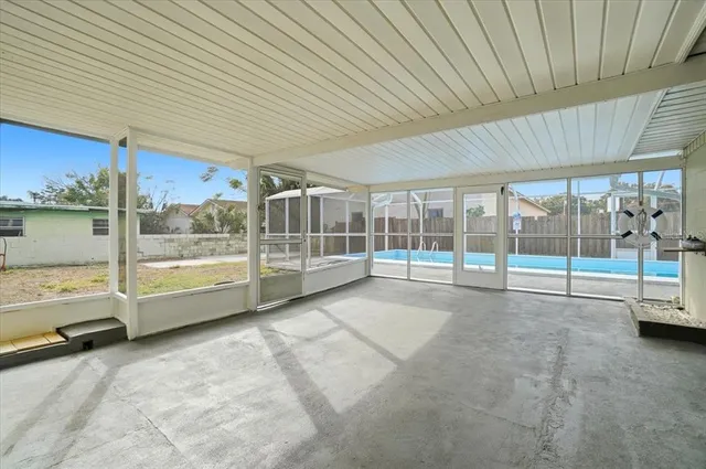 a view of a backyard with a wooden deck