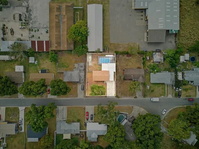 an aerial view of a house with outdoor space