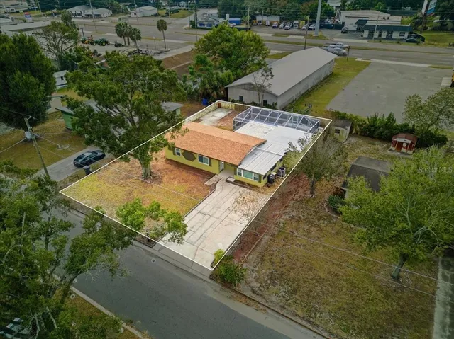 a view of a backyard with sitting area