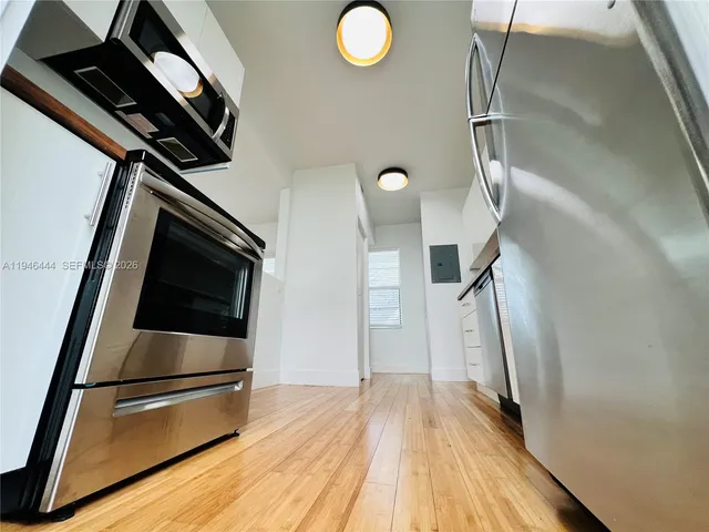 a view of kitchen and wooden floor