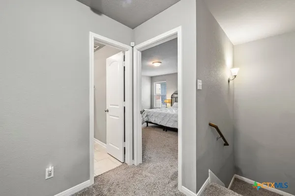a view of a bathroom from the hallway