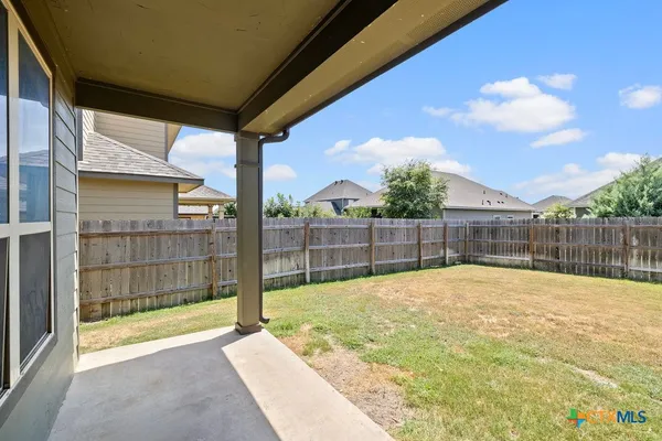 a house view with a backyard space