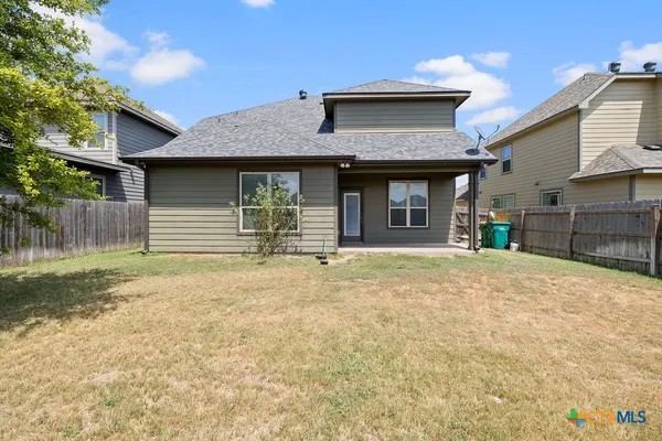 an aerial view of a house with a swimming pool