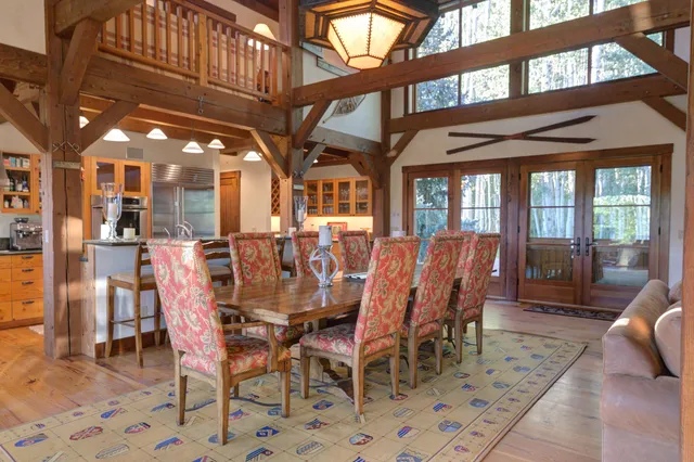 a view of balcony with wooden floor and outdoor seating