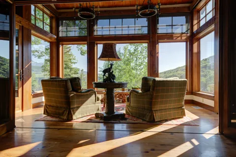 a view of backyard with green space and deck