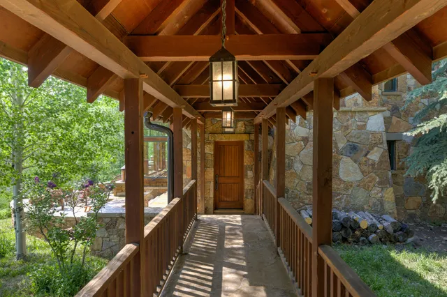 a front view of a house with a yard table and chairs