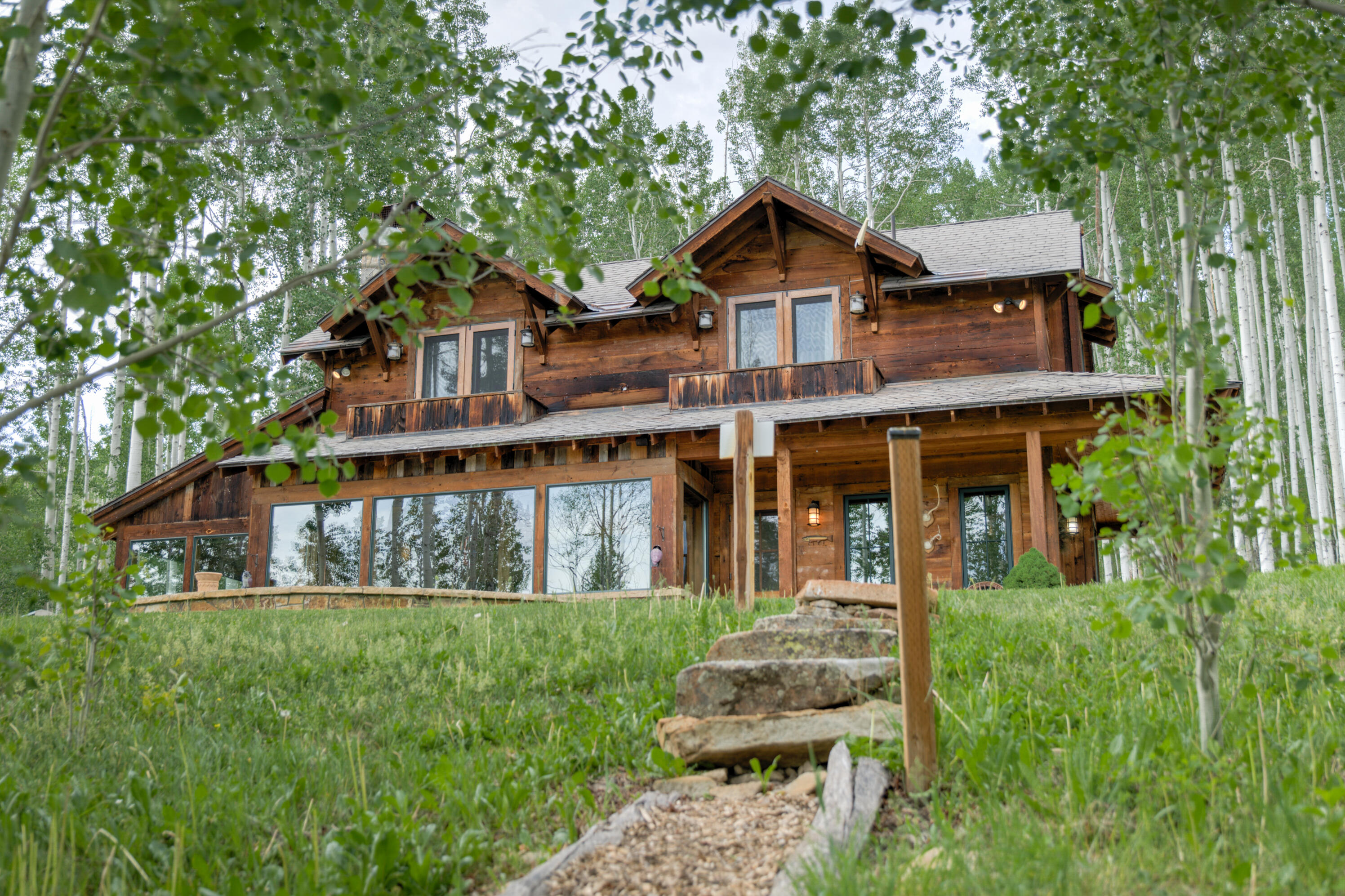 6131 Last Dollar Road Telluride, CO 81435 - Photo 62 of 86 a front view of a house with a yard