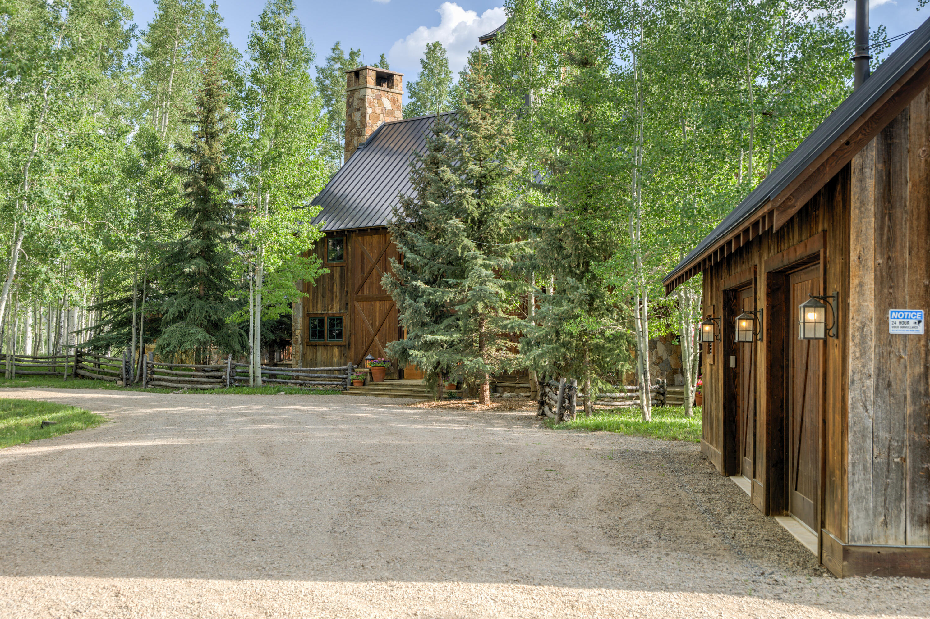 6131 Last Dollar Road Telluride, CO 81435 - Photo 8 of 86 a view of a house with backyard and trees