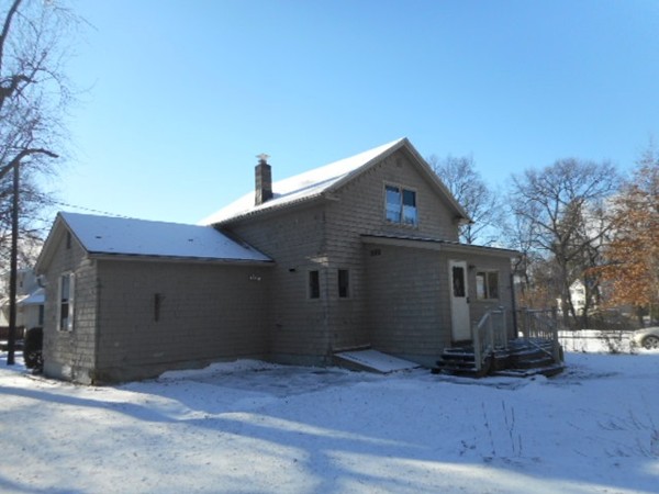 211 Davis Street Springfield, MA 01104 - Photo 4 of 13 a front view of a house with a garage