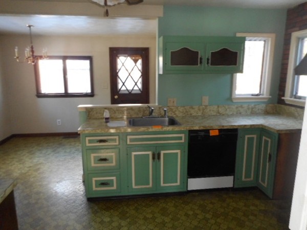 211 Davis Street Springfield, MA 01104 - Photo 6 of 13 a kitchen with a sink and a mirror
