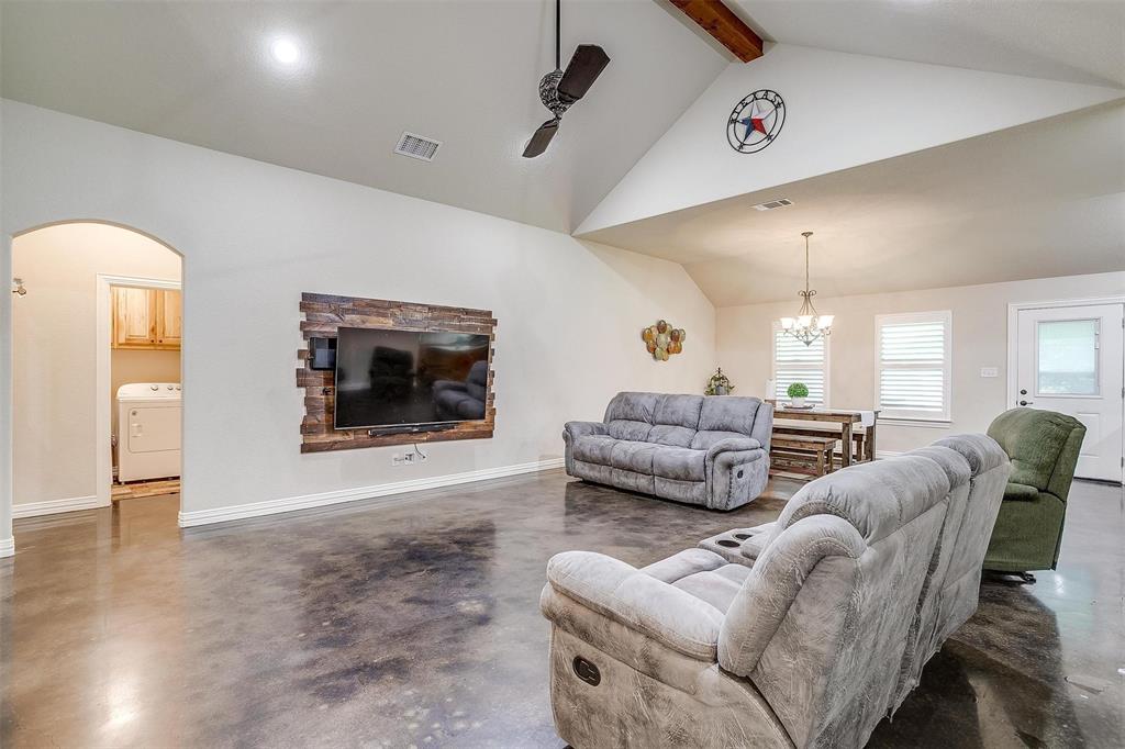 505 N Avenue East Springtown, TX 76082 - Photo 6 of 27 a living room with furniture and a flat screen tv