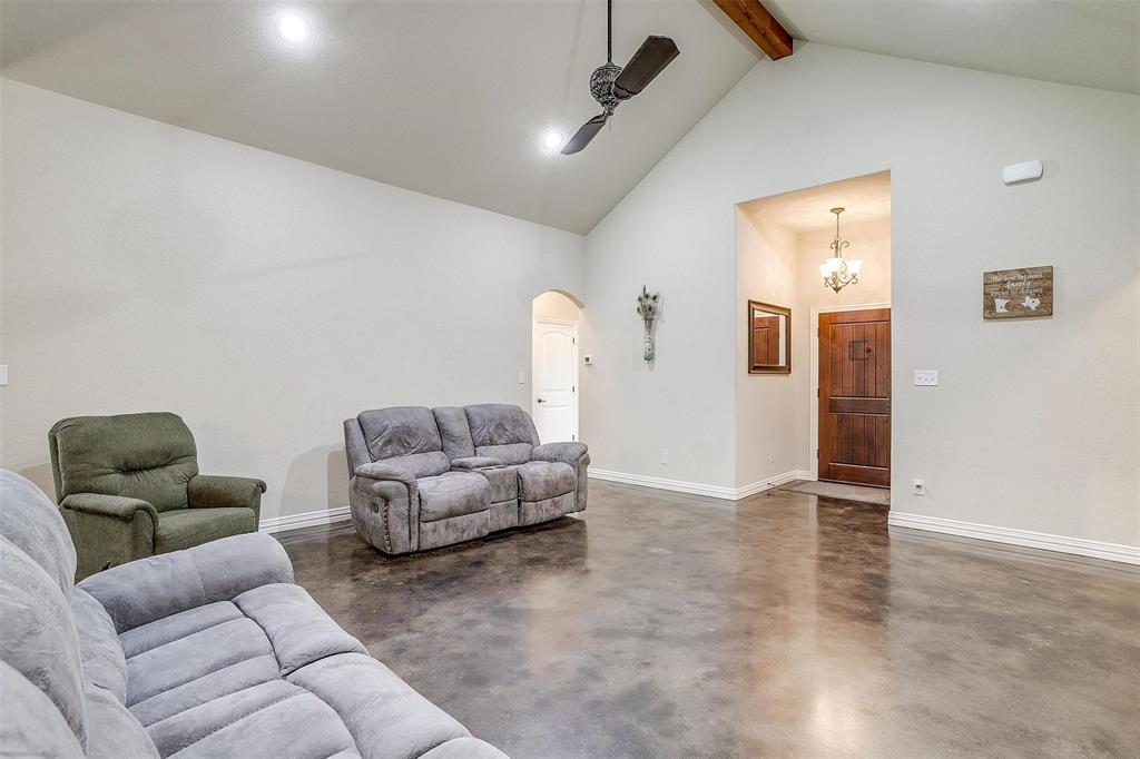 505 N Avenue East Springtown, TX 76082 - Photo 9 of 27 a living room with furniture and a ceiling fan