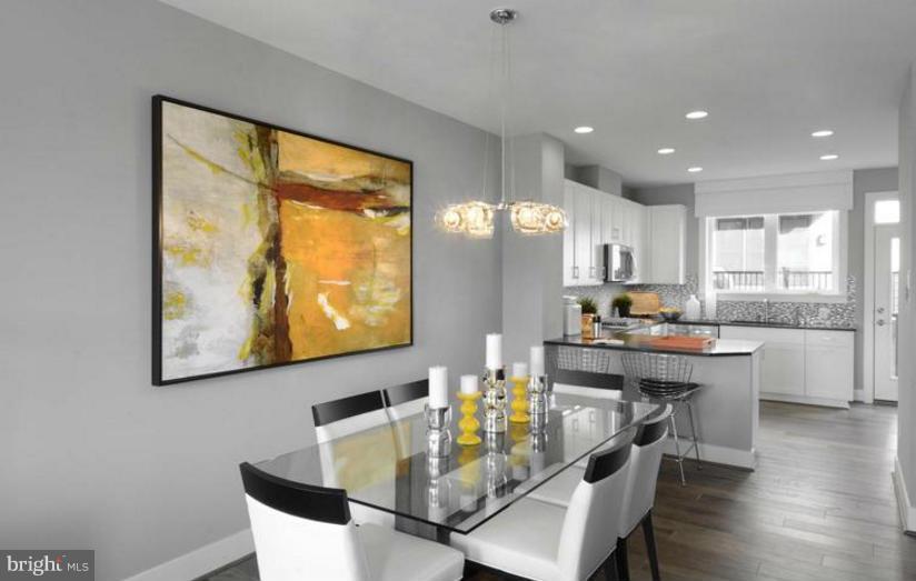6680 Eames Way Bethesda, MD 20817 - Photo 2 of 19 a view of a dining room with furniture window and wooden floor