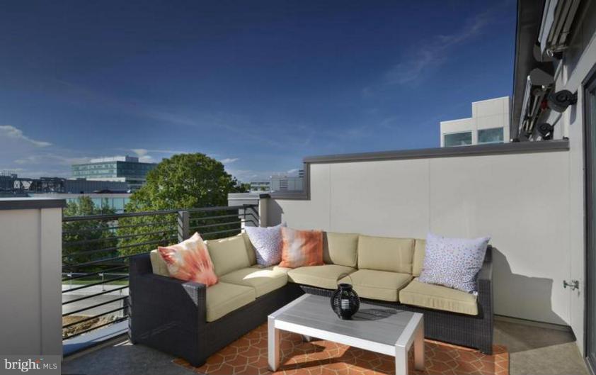 6680 Eames Way Bethesda, MD 20817 - Photo 12 of 19 a outdoor living space with furniture and a potted plant