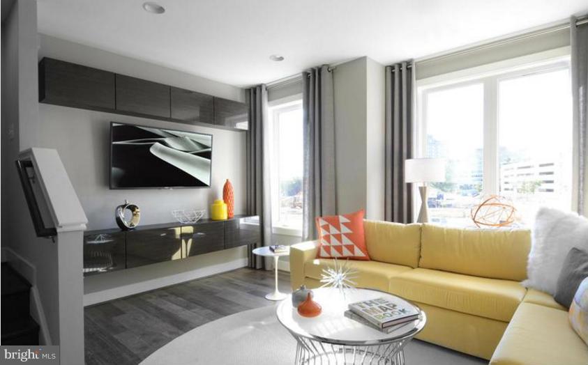 6680 Eames Way Bethesda, MD 20817 - Photo 6 of 19 a living room with furniture and a flat screen tv