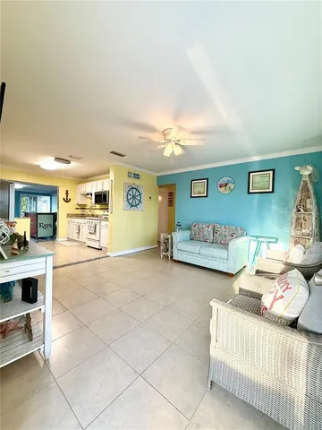 a spacious bedroom with a bed a table and chair