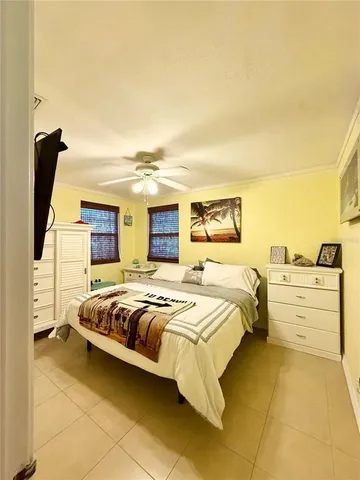 a bed room with a bed and cabinets