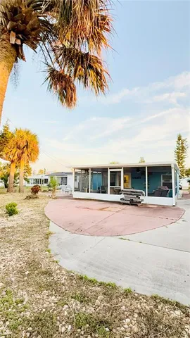 a swimming pool with outdoor seating and yard
