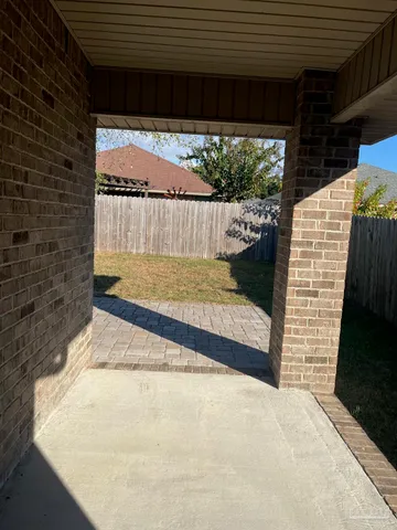 a front view of a house with a lots of plants