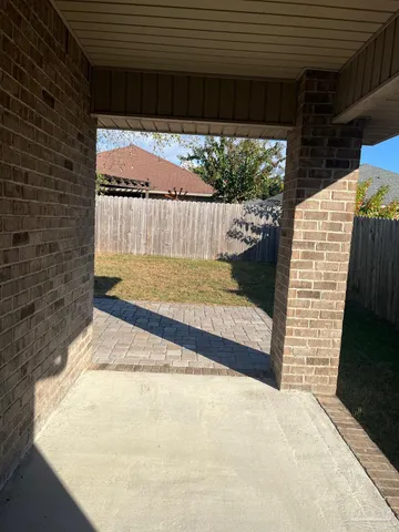 a large kitchen with cabinets stainless steel appliances a sink and a counter space