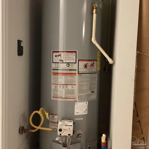 a view of a kitchen with wooden floor and a ceiling fan