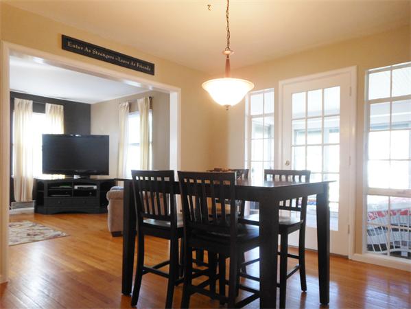 24 Benz Street Springfield, MA 01118 - Photo 7 of 21 a view of a dining room with furniture window and wooden floor