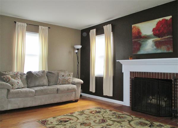 24 Benz Street Springfield, MA 01118 - Photo 9 of 21 a living room with furniture and a fireplace