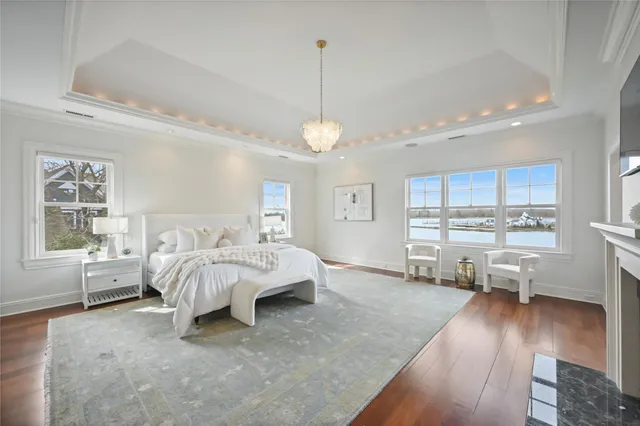 a spacious bedroom with a bed and a fireplace