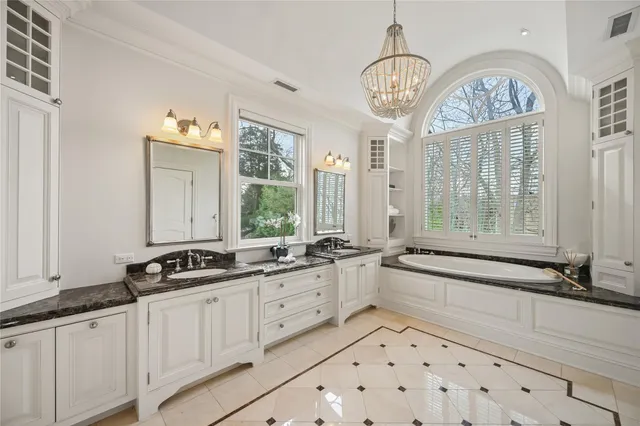a bathroom with a double vanity sink and mirror