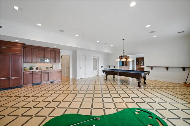 a spacious bedroom with a bed and a couch