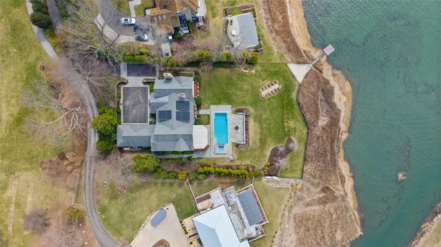 a picture of a bathroom with a white wall and a picture