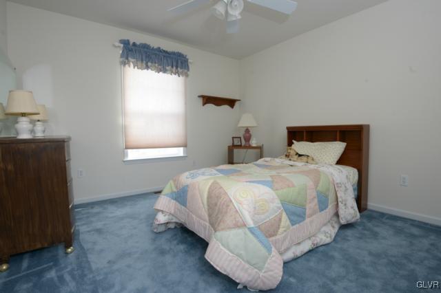 4140 Walter Road Bethlehem, PA 18020 - Photo 13 of 21 a bed sitting in a bedroom next to a window