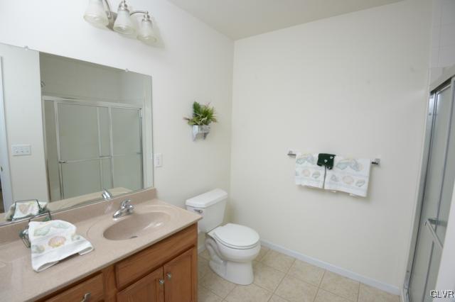 4140 Walter Road Bethlehem, PA 18020 - Photo 16 of 21 a bathroom with a granite countertop sink a toilet and mirror