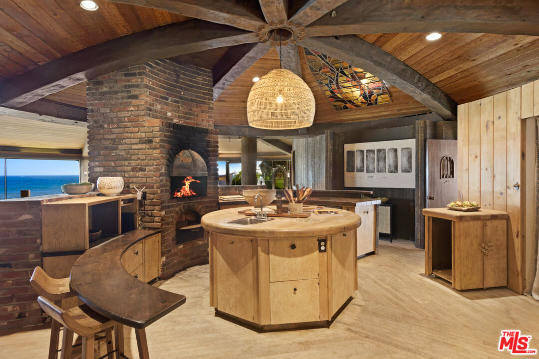 33604 Pacific Coast Highway Malibu, CA 90265 - Photo 13 of 46 a living room with a stove kitchen island and furniture