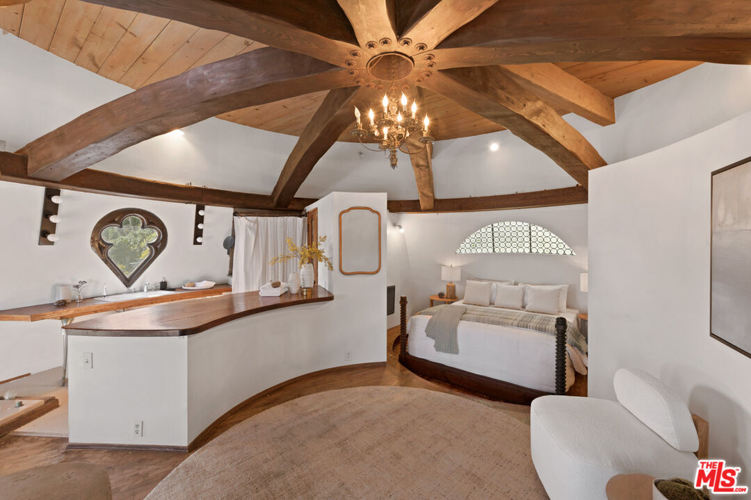 33604 Pacific Coast Highway Malibu, CA 90265 - Photo 16 of 46 a living room with furniture and a chandelier