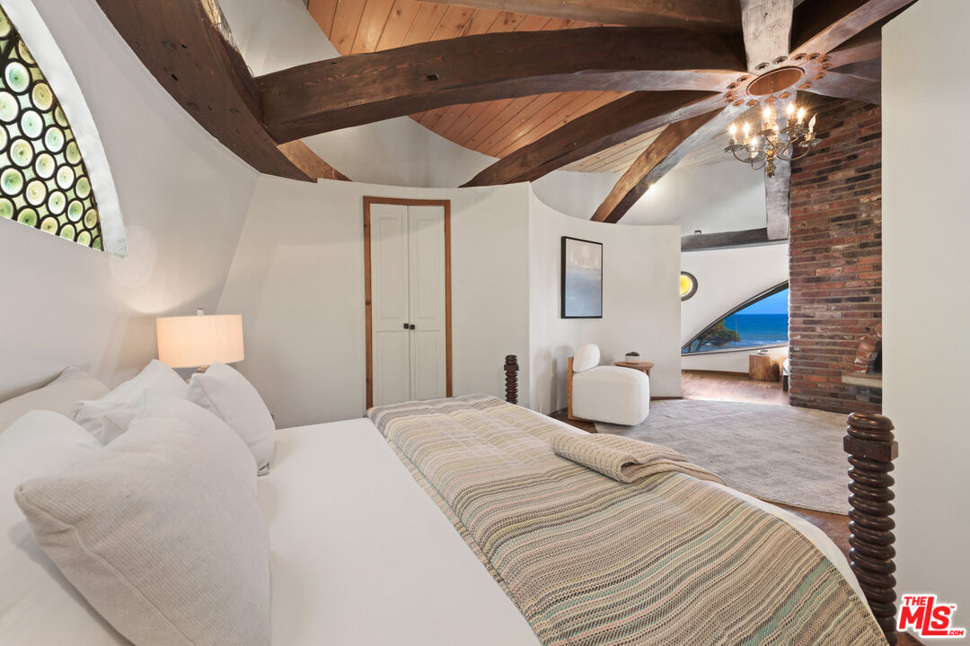 33604 Pacific Coast Highway Malibu, CA 90265 - Photo 17 of 46 a bedroom with a bed and a lamp