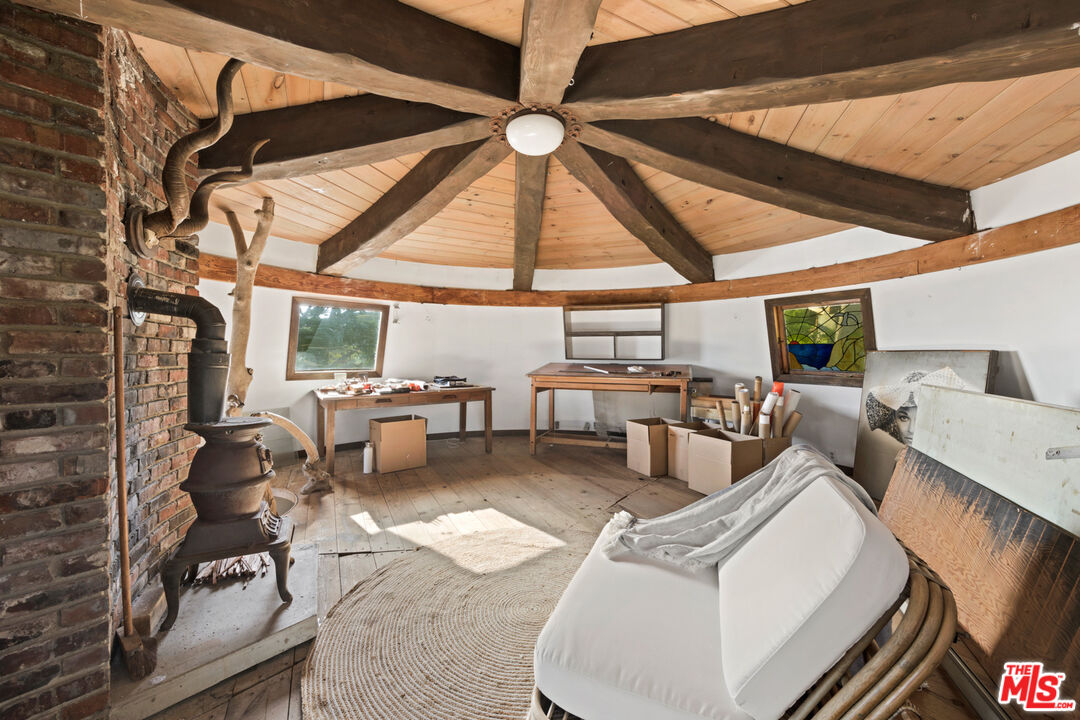 33604 Pacific Coast Highway Malibu, CA 90265 - Photo 20 of 46 a living room with patio furniture and a large window