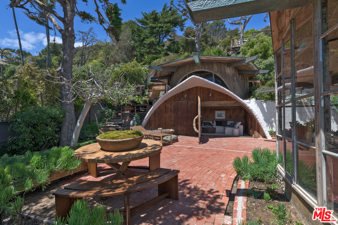33604 Pacific Coast Highway Malibu, CA 90265 - Photo 22 of 46 a view of a backyard with sitting area