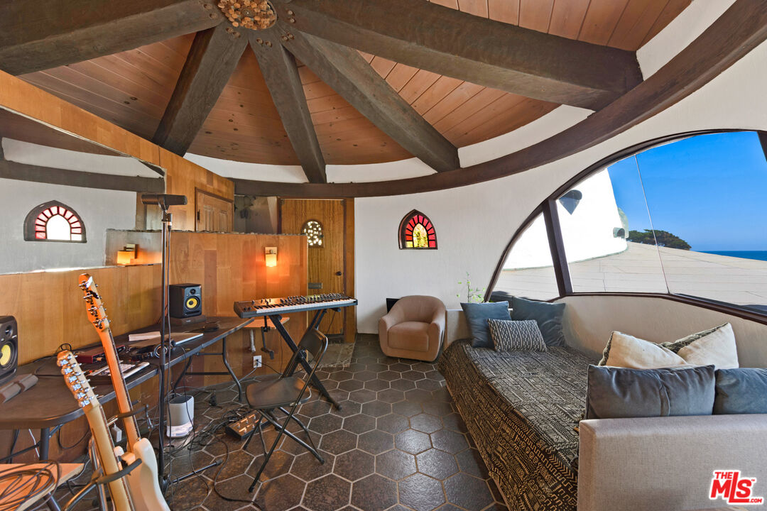 33604 Pacific Coast Highway Malibu, CA 90265 - Photo 23 of 46 a room with granite countertop furniture and a ceiling fan