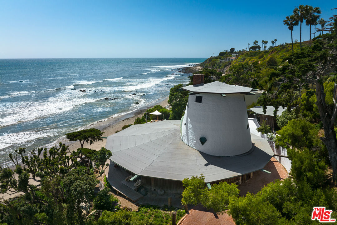 33604 Pacific Coast Highway Malibu, CA 90265 - Photo 3 of 46 an aerial view of a house with a yard and lake view