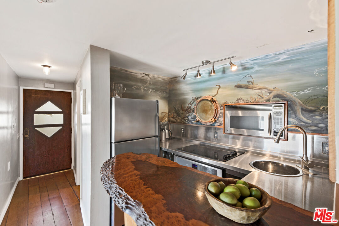 33604 Pacific Coast Highway Malibu, CA 90265 - Photo 33 of 46 a room with furniture and wooden floor