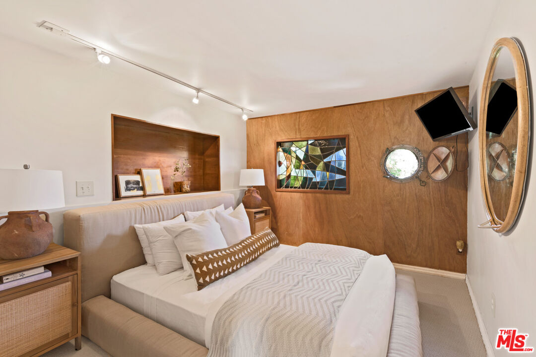 33604 Pacific Coast Highway Malibu, CA 90265 - Photo 34 of 46 a bedroom with a bed and a couch